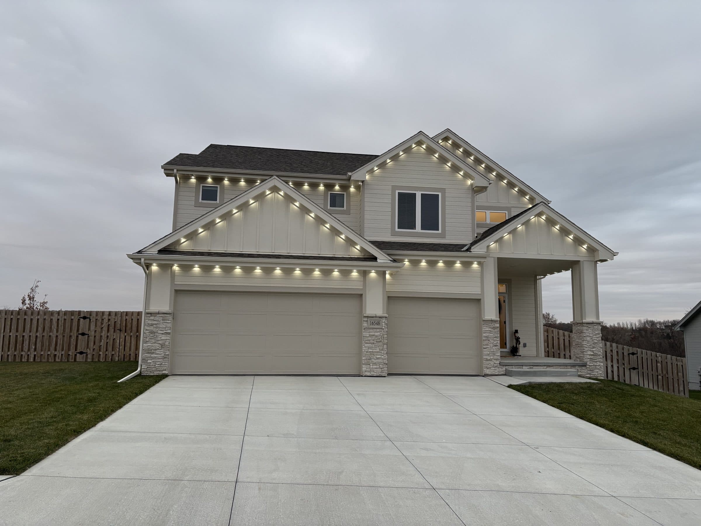 Daytime view of a new build with permanent light track along the roofline